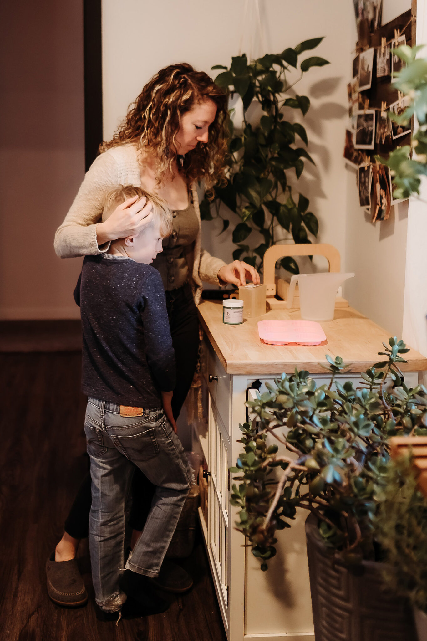 Denver documentary family photographer capturing raw, unposed moments of love and connection as mom and son have a sweet moment in the kitchen