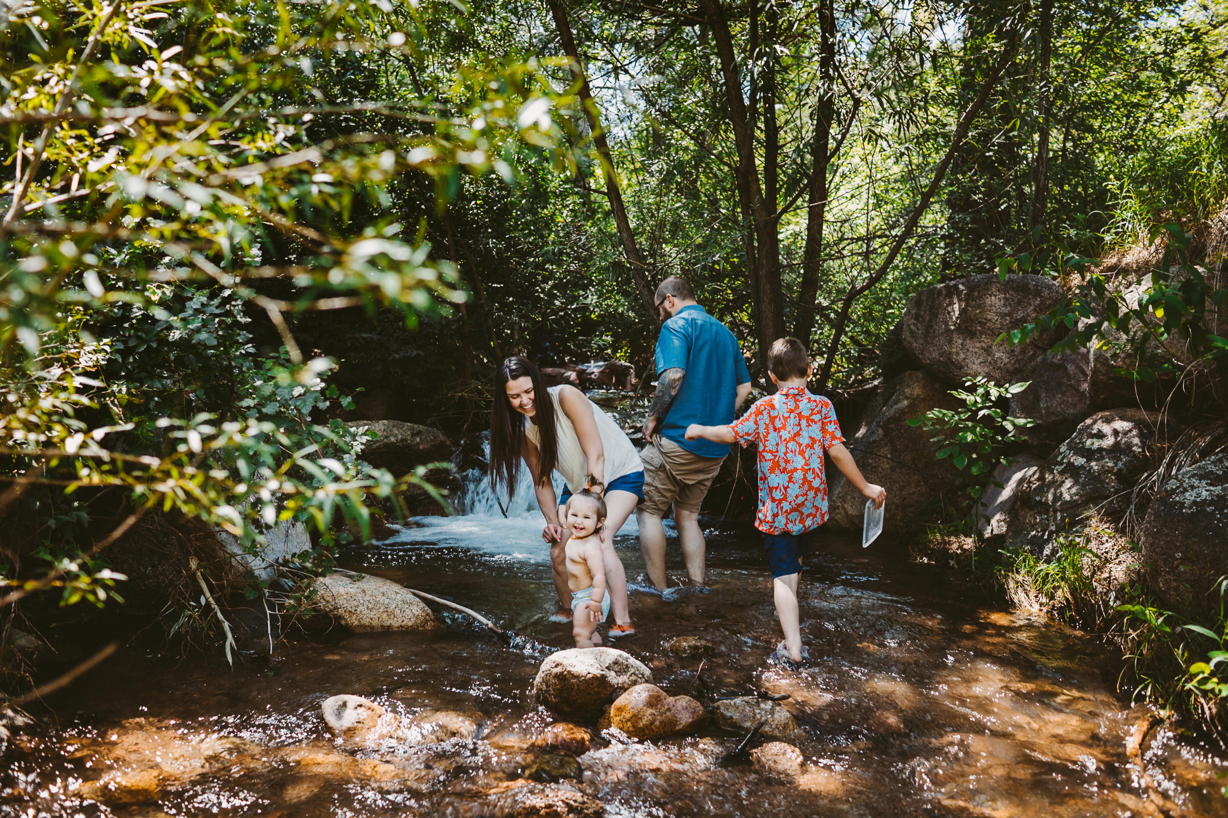 colorado springs family playing in the creek for their photo session