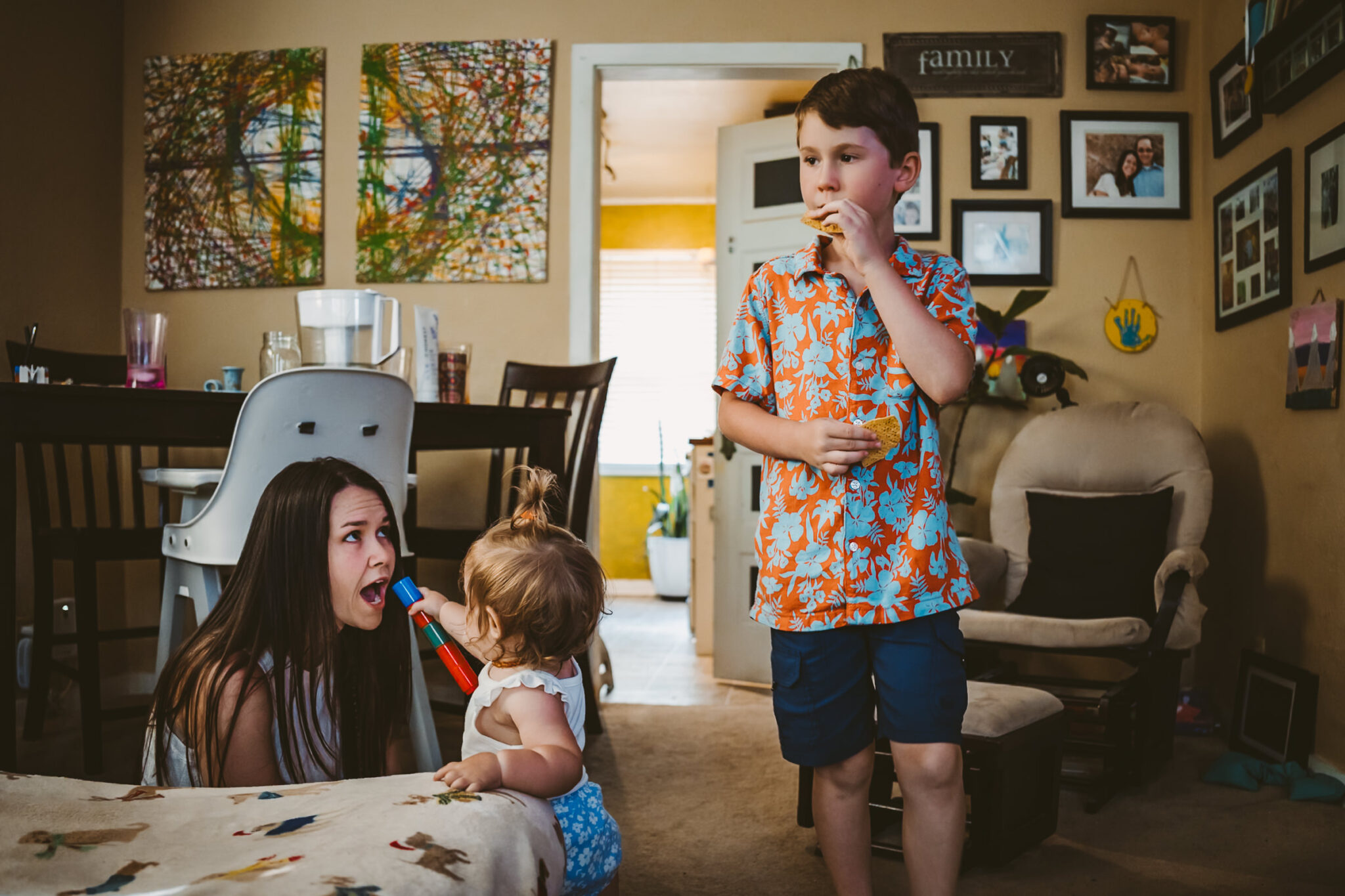 family plays in living room in downtown colorado springs