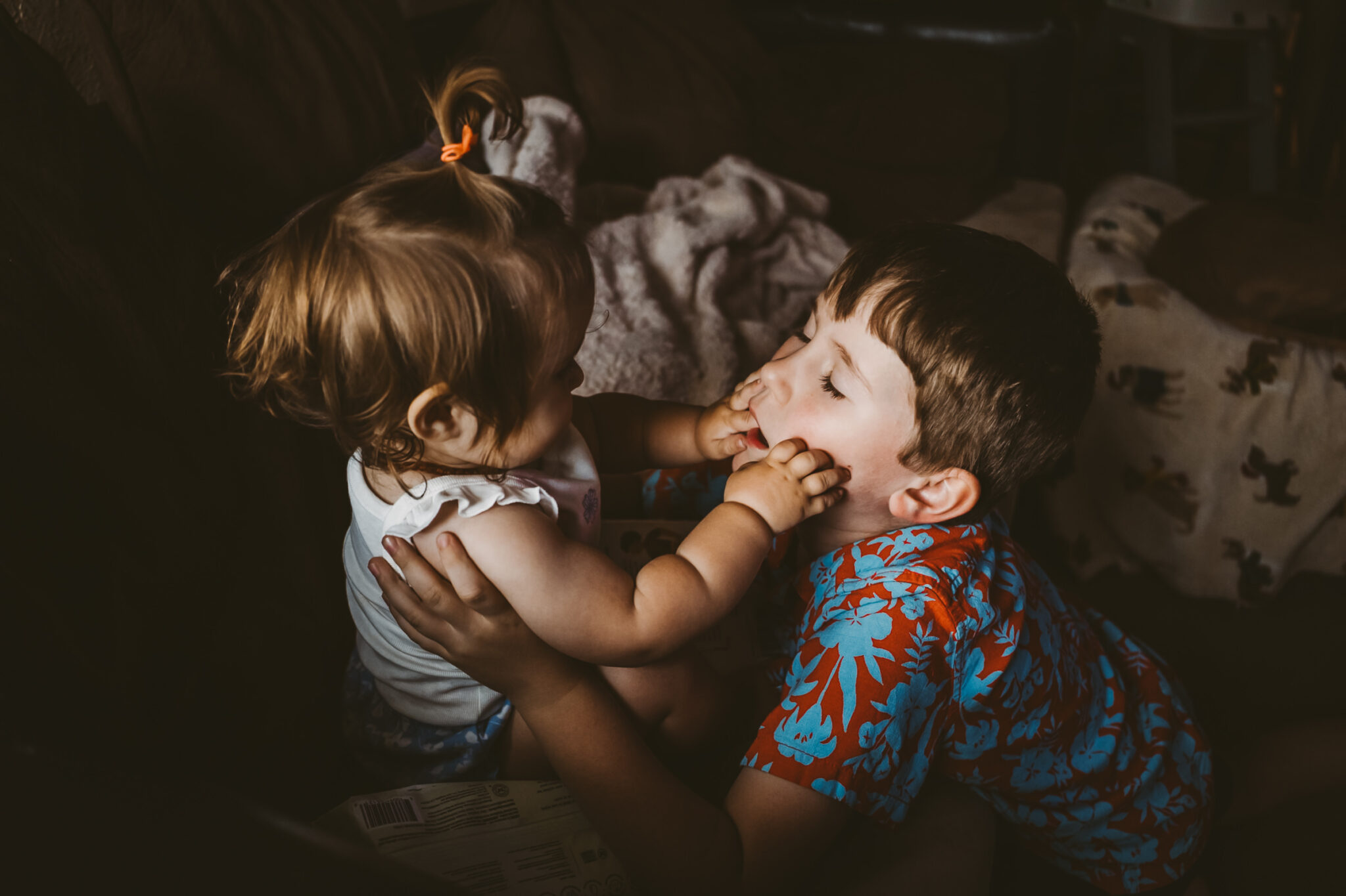 brother and sister play in home documentary session